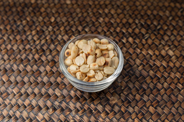 Roasted nuts in clear glass cup on the tray, Natural light beautiful.