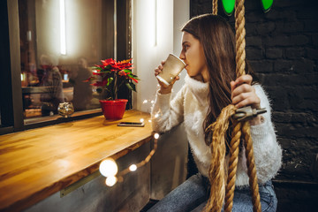 woman drink warm up tea in cafe