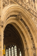 The architectural detail of the royal entrance below the Victoria Tower at the British Parliament building in London, England.