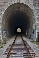 Fototapeta na wymiar Tunnels and railways. Light on the end of the tunnel