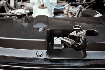 details of car engine, bonnet and hood lock system