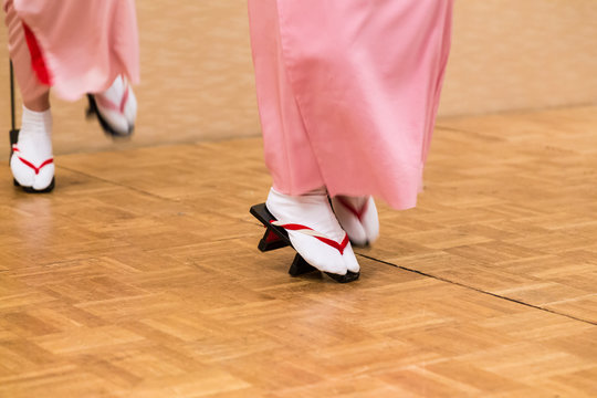Japanese women dancing in traditioanl dress and geta shoes