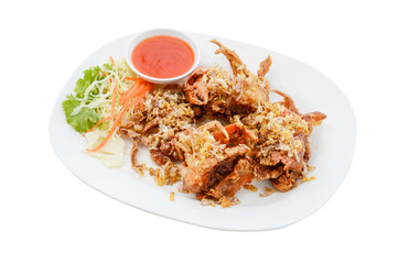 Soft Shell Crab fried with garlic on white plate and white background.