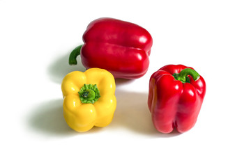 Yellow and two red peppers