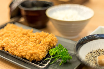 Close up of Tonkatsu is a Japanese dish which consists of a breaded, deep fried pork cutlet