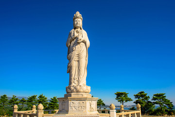 Fototapeta na wymiar A stone statue of Buddha called Haesugwaneumsang.
