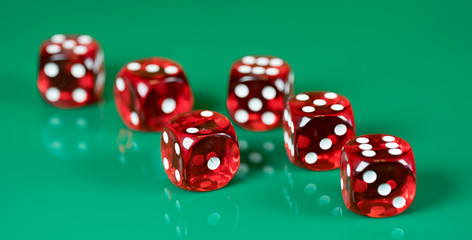 playing poker dice on green background