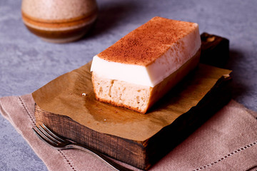 Piece of biscuit cake with souffle on a plate