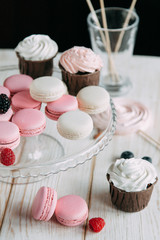 tender berry biscuit cakes in composition, fabric and wooden background