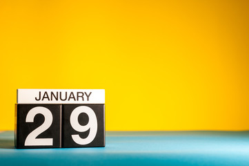 January 29th. Day 29 of january month, calendar on yellow background. Winter time. Empty space for text