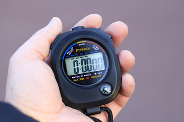 stopwatch,  stopwatch in the coach's hand