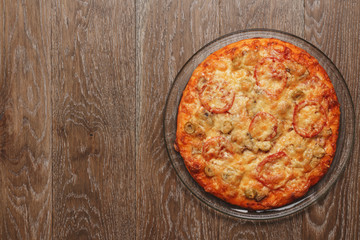 top view of pizza with bacon, ham and mushrooms