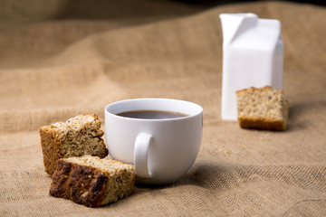 Cup of coffee with rusks  with jug 
