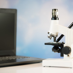 Science laboratory research and development concept. microscope with test tubes