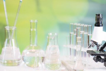 Science laboratory research and development concept. microscope with test tubes