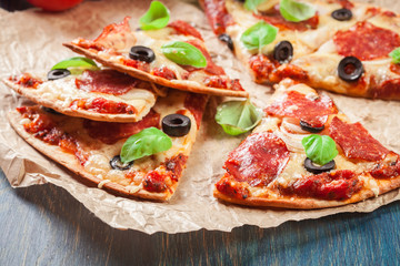 Slices of pizza pepperoni with olives