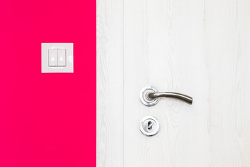 Electricity switch in a bright orange wall