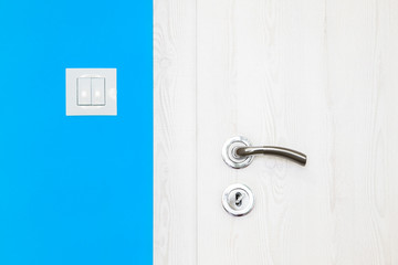 Electricity switch in a bright orange wall