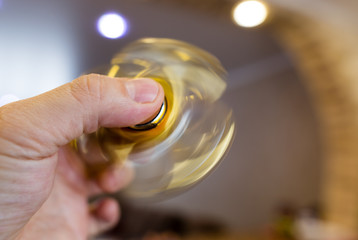 The golden spinner is spinning in his hand