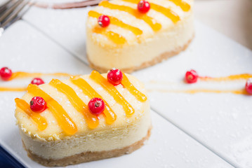 Fresh aromatic cake cheesecake on a white plate.
