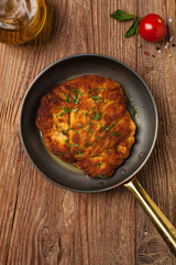 Chicken schnitzel in a pan