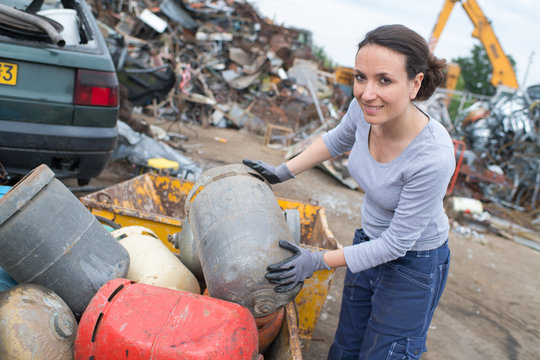 female worker at a scrap yard