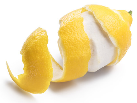 Peeled lemon and lemon zest on white background. Close-up.