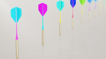 Line of Vibrantly Colored Playing Darts on Simple Light Grey Surface