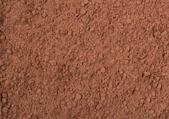 Texture background. Cocoa  chocolate brown powder Top view