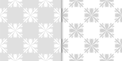 Light gray floral backgrounds. Set of seamless patterns