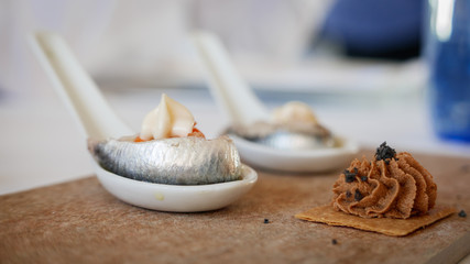 Fototapeta na wymiar Spanish tapa with anchovy over spoon