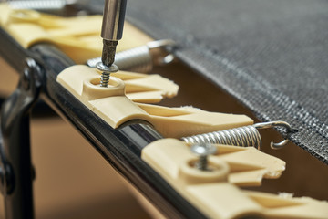 Replacement of broken plastic bed slat holders on folding bed