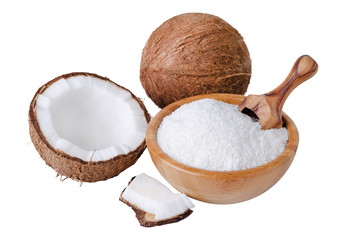 coconut flakes in a wooden bowl with scoop isolated on white