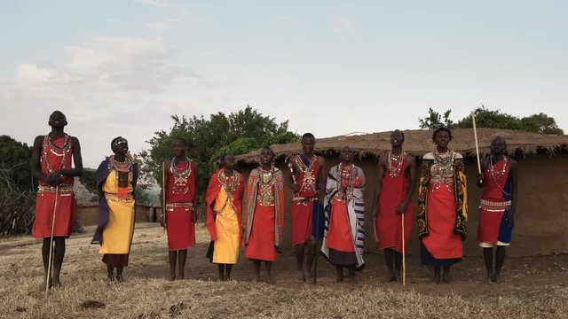 maasai women and men sing then dance together in pairs at a village near masai mara in kenya