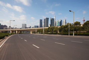 Empty road surface floor with city landmark buildings of Shanghai Skyline