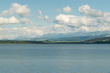 Orava reservoir with mountains in the background
