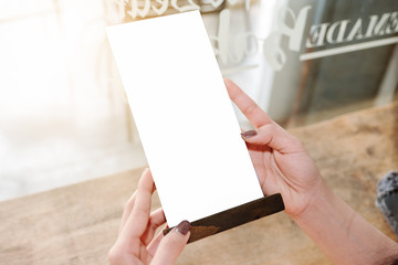 Mock up Menu frame in Bar restaurant ,Stand for booklets with white sheets of paper acrylic tent...