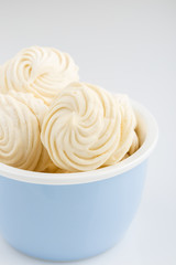 Homemade white zephyr or marshmallow on blue bowl