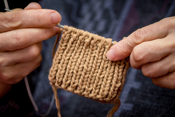 the process of knitting needles made of threads, socks or mittens, hobbies, work at home