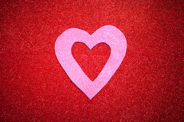 red glittery background with pink heart, Valentine's Day, texture abstract background, suitable for ads, insert text, romantic