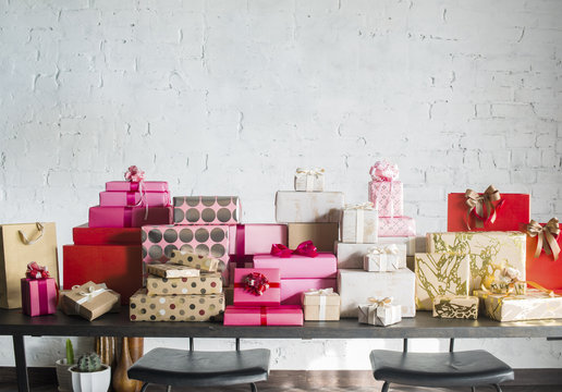 Stacks of colorful gift boxes on a table.