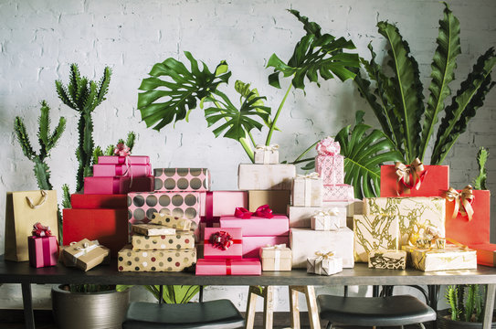 Stacks of colorful gift boxes on a table.