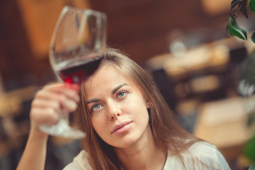Attractive girl with a wine glass