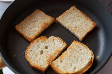 Slices of toast bread on wooden table, top view