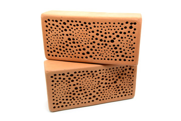 Insect hotel made of Brick stone for wild bees and wasps insects.