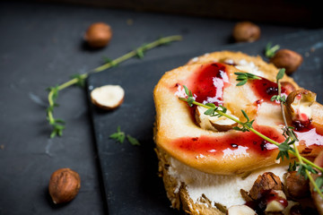 Bread with ricotta cheese and pears on the wooden background. Shallow depth of field.