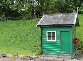 Fototapeta na wymiar A Railway Trackside Wooden Workmans Store Hut.