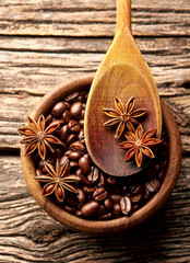  Coffee,  anise in brown bowl on wooden background. 