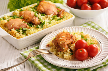 Oven baked chicken meat with rice.