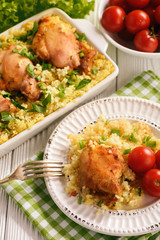 Oven baked chicken meat with rice.